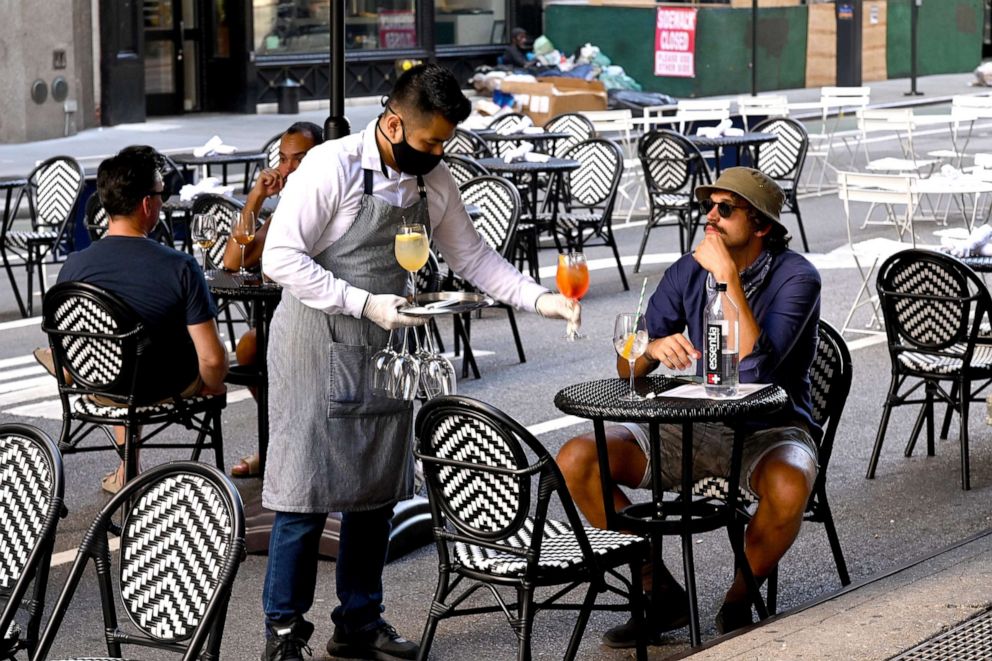 PHOTO: An outdoor dining area is seen as the city continues Phase 4 of re-opening following restrictions imposed to slow the spread of coronavirus on July 27, 2020 in New York City.