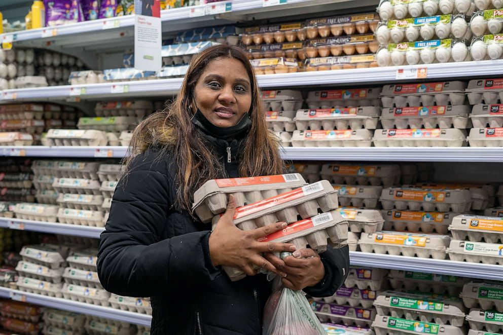 PHOTO: Sharmilla Dabieden grabs three cartons of eggs from Whole Foods, heading to Tribeca from Queens for more affordable prices.