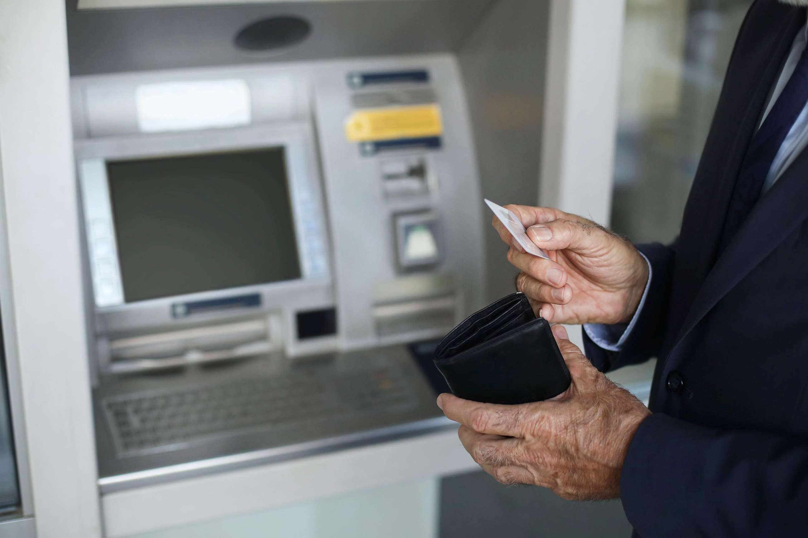 PHOTO: Senior citizen at an ATM.