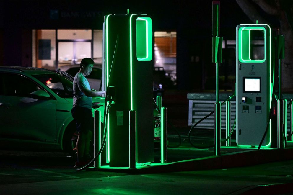 PHOTO: A driver charges his electric vehicle at a charging station as the California Independent System Operator announced a statewide electricity Flex Alert urging conservation to avoid blackouts, Aug. 31, 2022, in Monterey Park, Calif.