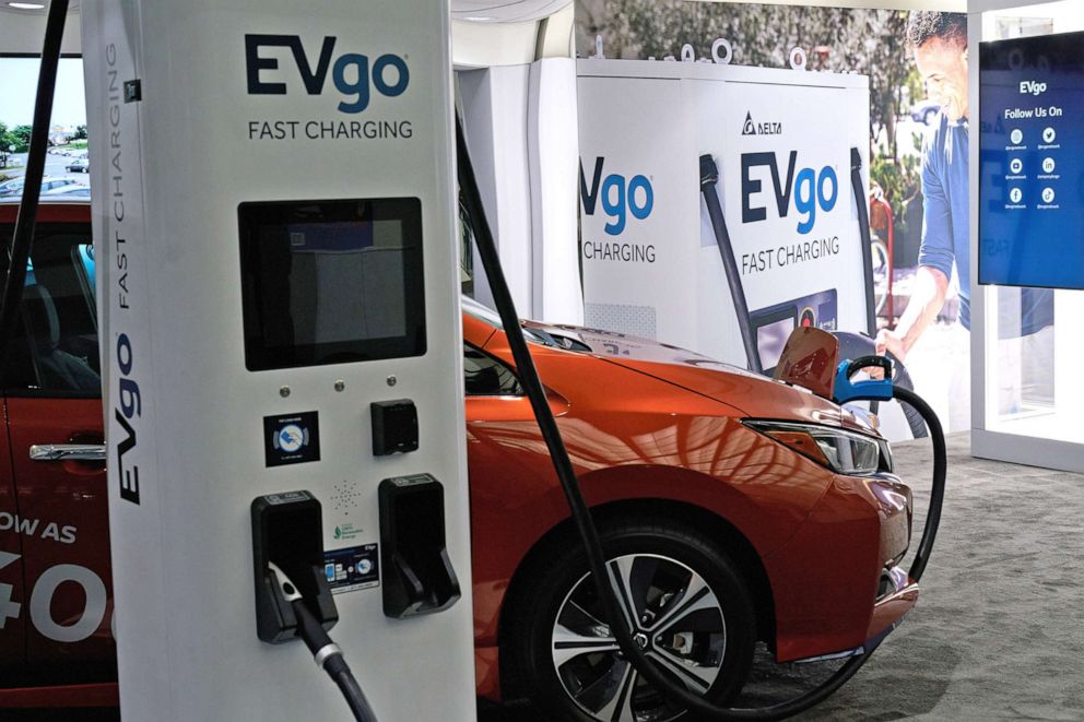 PHOTO: A Nissan Leaf electric vehicle is connected to an EVgo electric charger at the Los Angeles Auto Show in Los Angeles, Nov. 18, 2021.