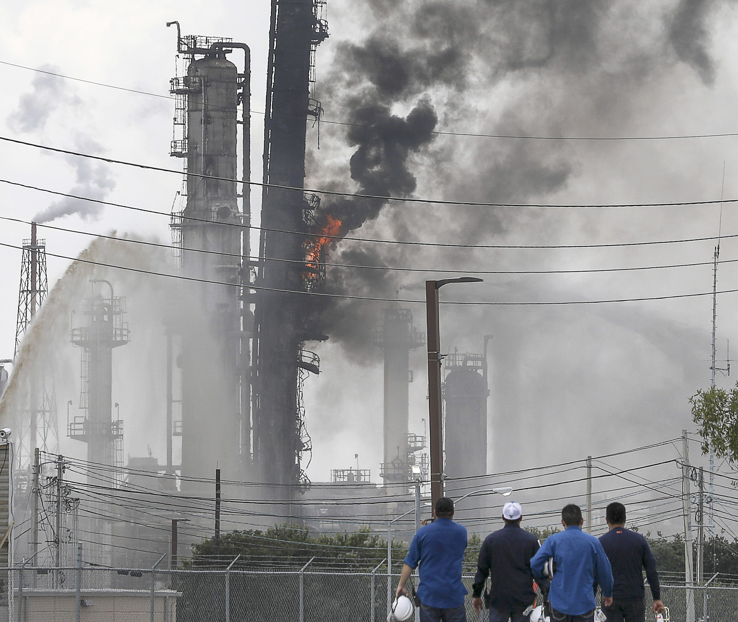 PHOTO: Flames and smoke rise after a fire started at an Exxon Mobil facility, July 31, 2019, in Baytown, Texas.