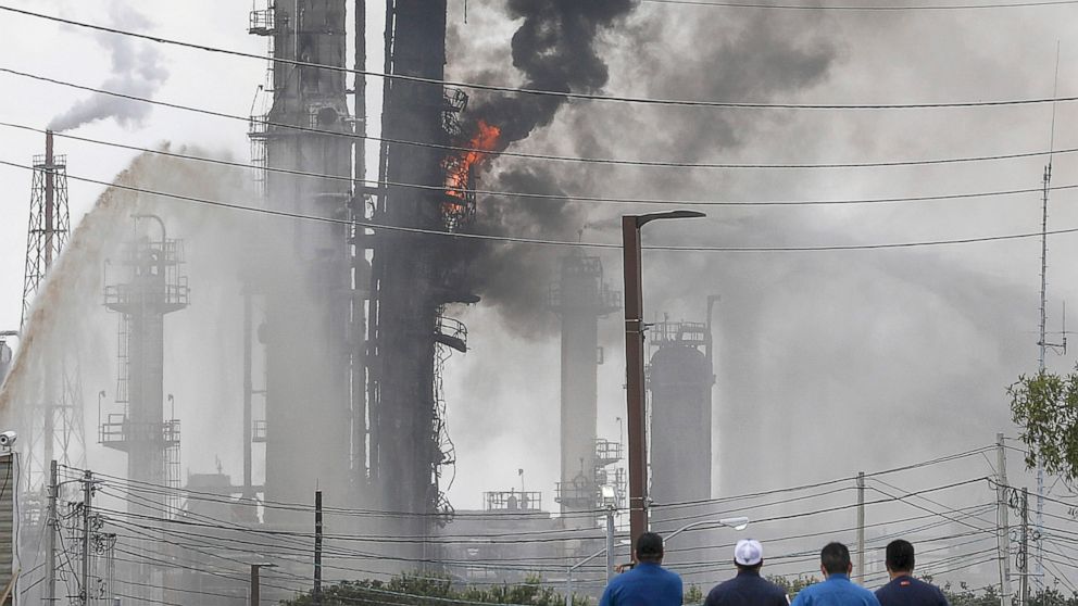 PHOTO: Flames and smoke rise after a fire started at an Exxon Mobil facility, July 31, 2019, in Baytown, Texas.