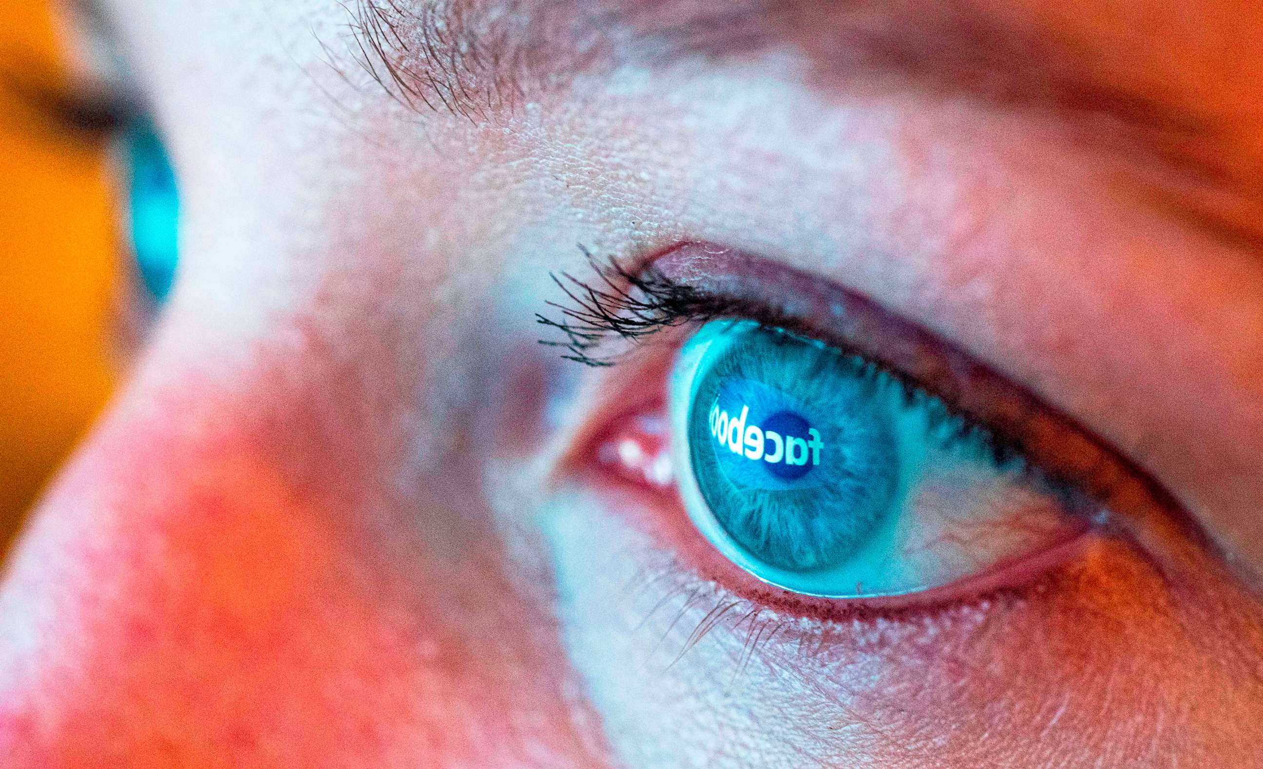 PHOTO: The Facebook logo is reflected in the eye of a woman viewing a computer display in Mill Valley, Calif., March 21, 2018.