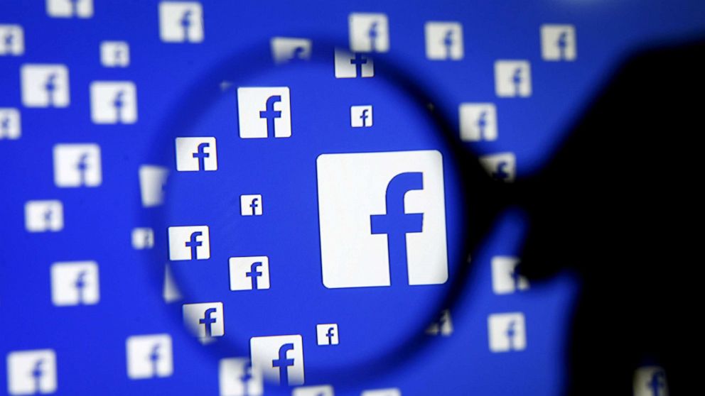 PHOTO: A man poses with a magnifier in front of a Facebook logo on display in this illustration taken in Sarajevo, Bosnia and Herzegovina, Dec. 16, 2015.