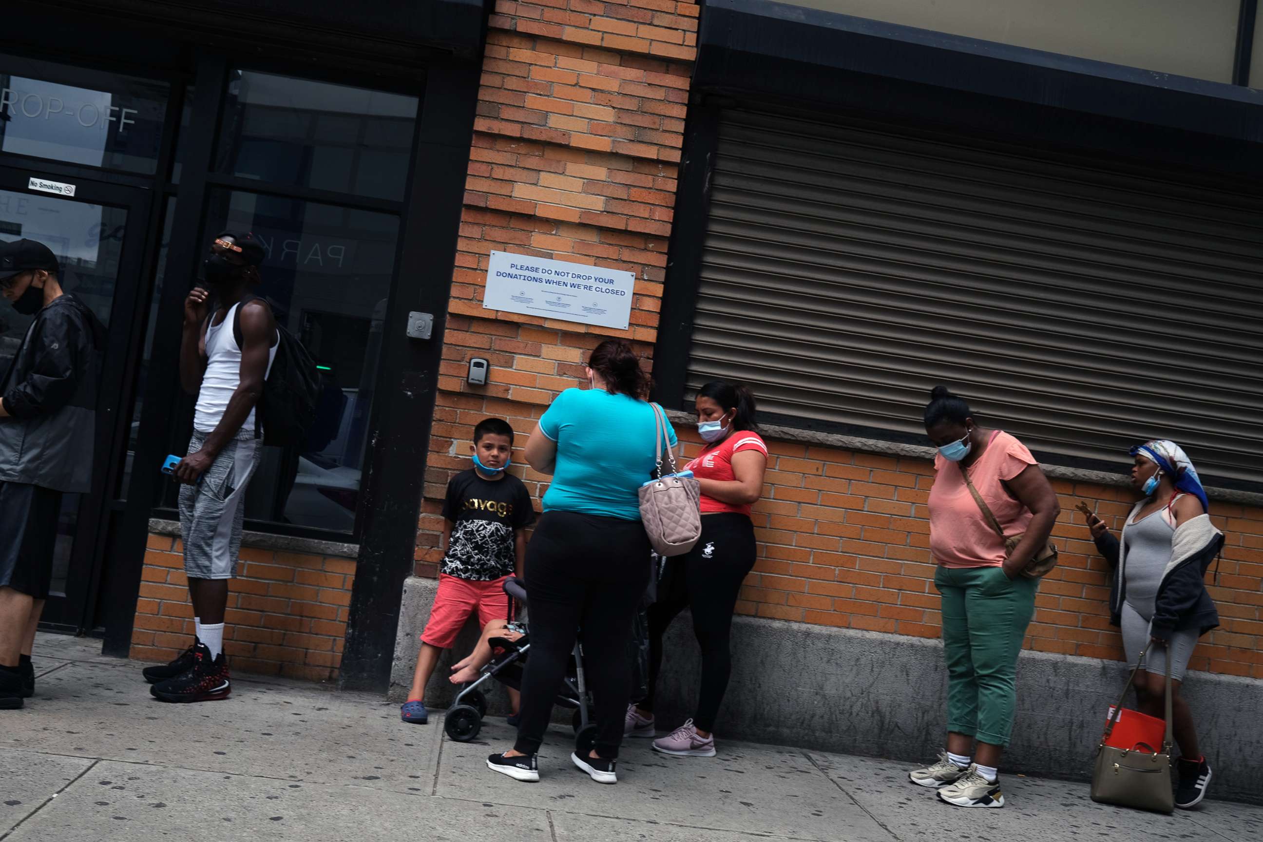 PHOTO: People wait in line for food assistance cards, July 7, 2020, in Brooklyn, N.Y.