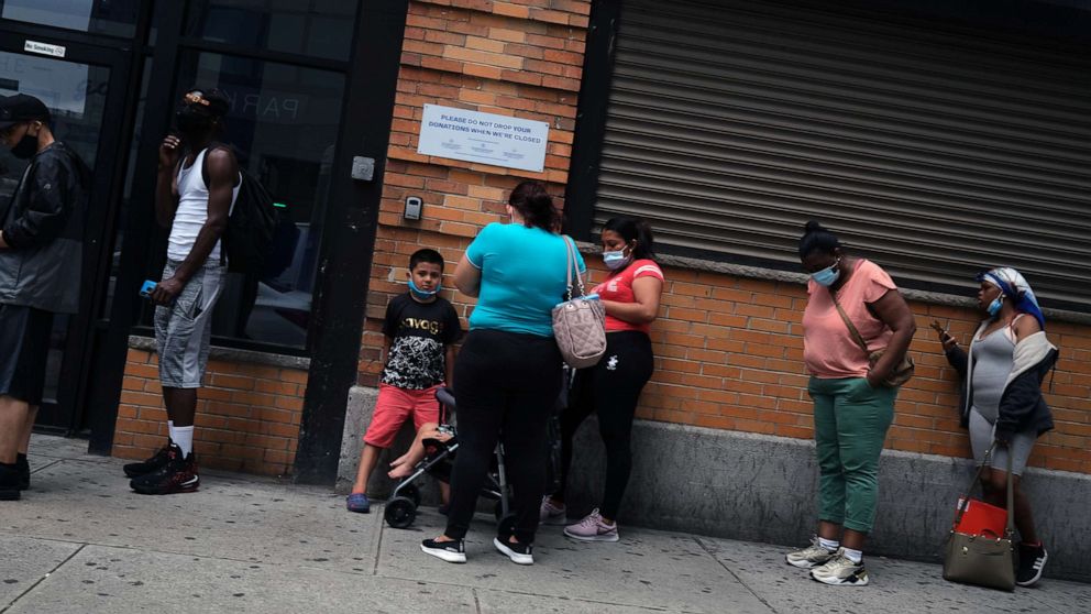 PHOTO: People wait in line for food assistance cards, July 7, 2020, in Brooklyn, N.Y.
