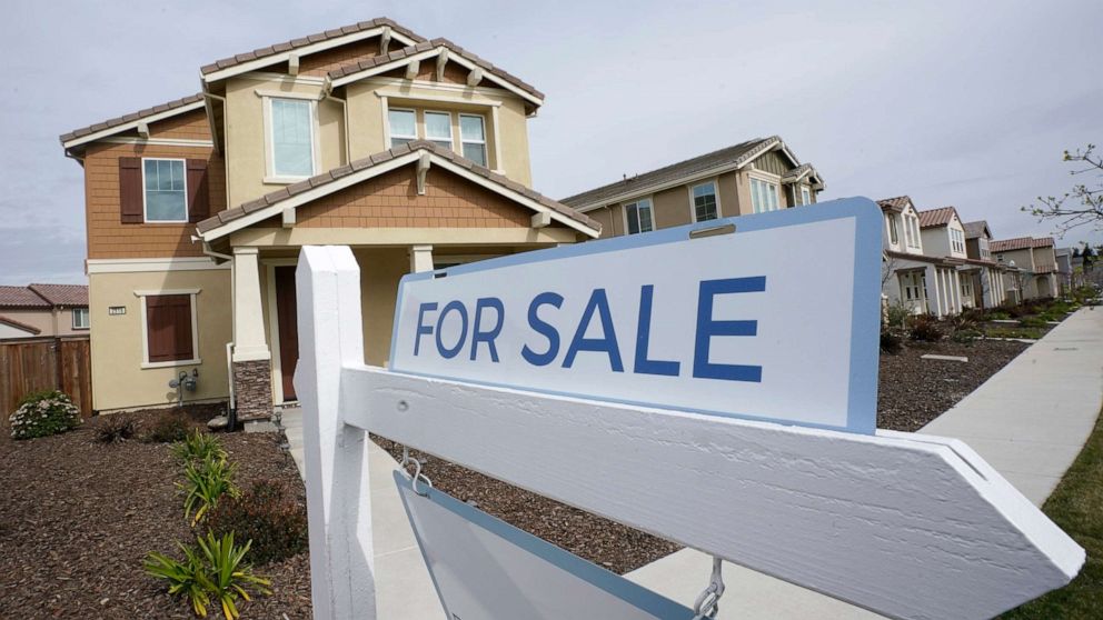 PHOTO: In this March 3, 2022, file photo, a for sale sign is posted in front of a home in Sacramento, Calif.