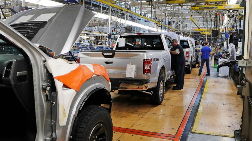 PHOTO: United Auto Workers assemblymen work on a 2018 Ford F-150 trucks being assembled at the Ford Rouge assembly plant in Dearborn, Mich., Sept. 27, 2018.