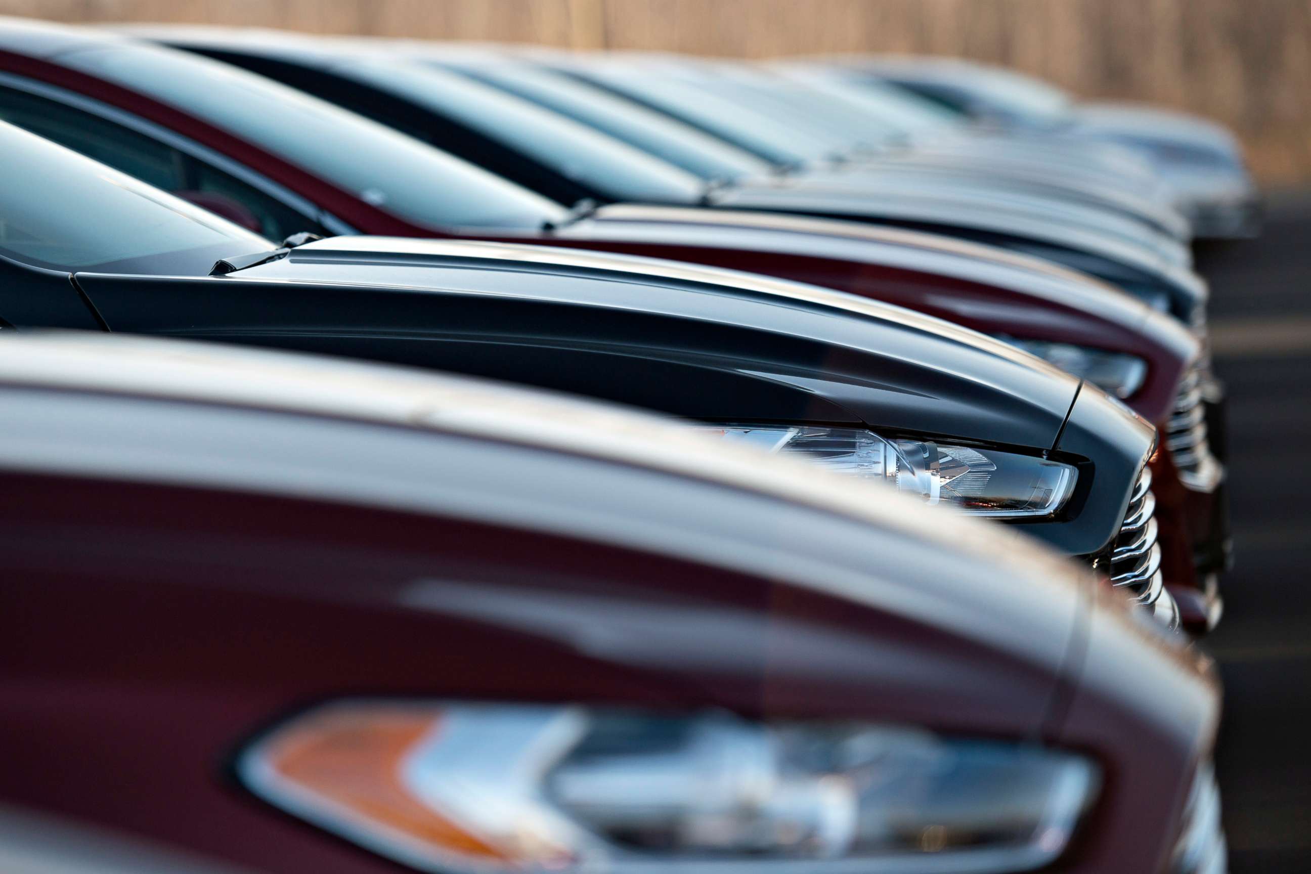 PHOTO: A row of 2014 Ford Fusion vehicles sit on display at a dealership in East Peoria, Ill., Nov. 30, 2013.
