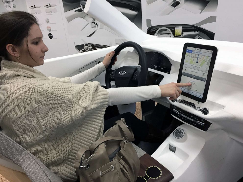 PHOTO: A woman tests out an early prototype of the Mustang Mach-E SUV at Ford's Product Development Center in Dearborn, Mich., in 2019.