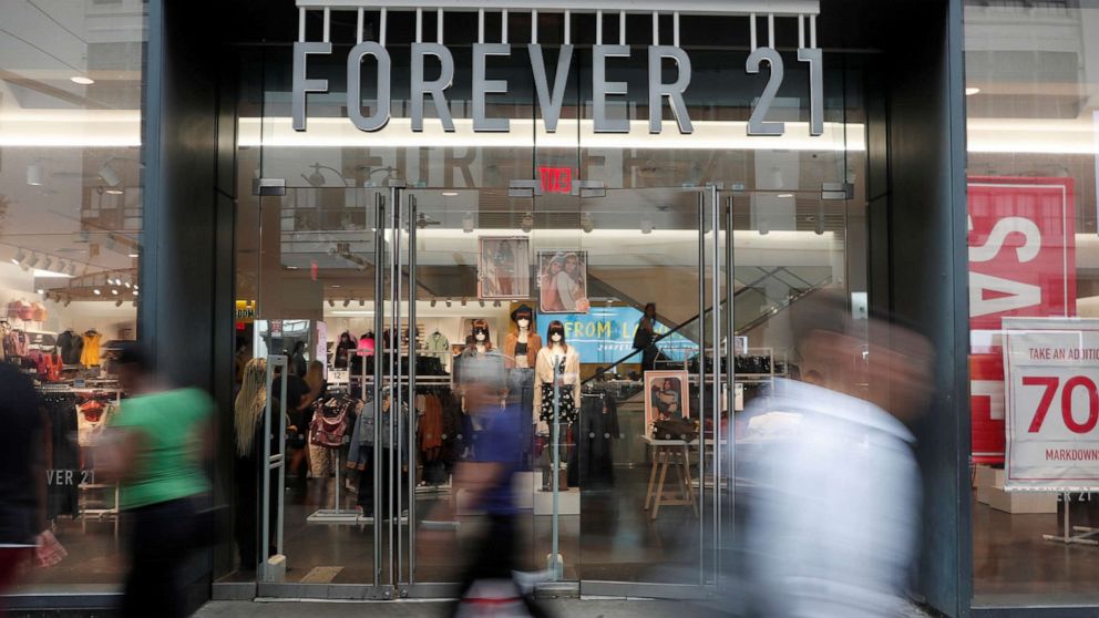 PHOTO: People walk by the clothing retailer Forever 21 in New York City, Sept. 12, 2019.