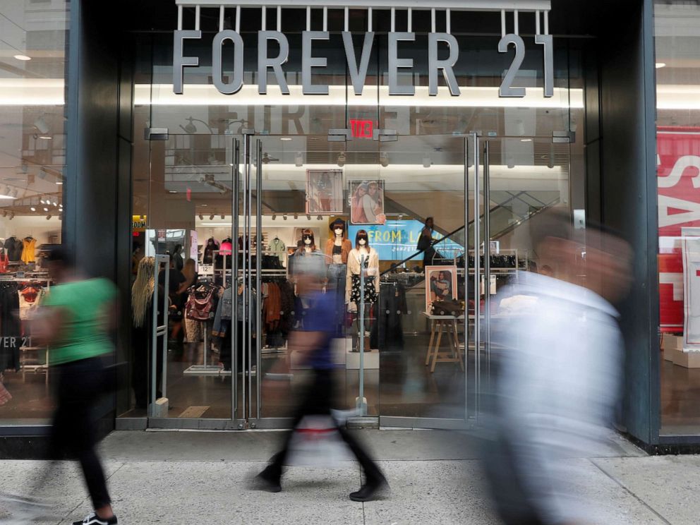 PHOTO: People walk by the clothing retailer Forever 21 in New York City, Sept. 12, 2019.