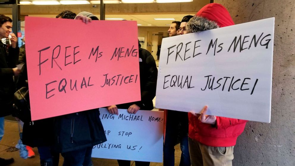 PHOTO: Protesters stand outside a courtroom Vancouver, Jan. 20, 2020, pressing for the release of a senior Chinese telecommunications executive fighting extradition to the U.S.