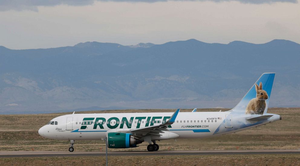 PHOTO: In this April 23, 2020 photo a Frontier Airlines jetliner taxis to a runway for take off from Denver International Airport in Denver.