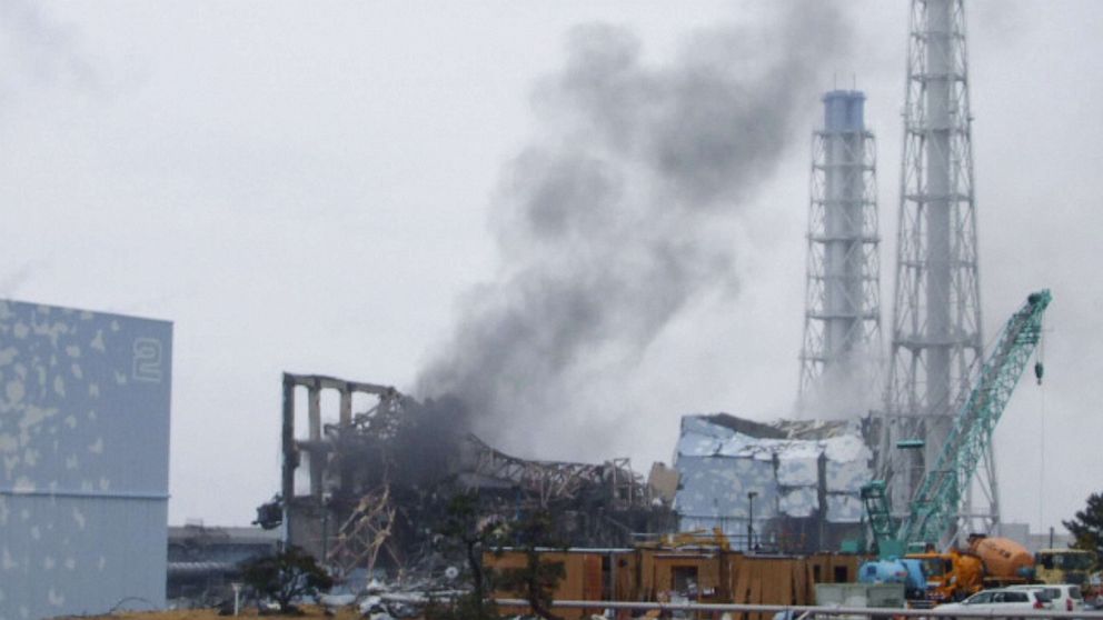 PHOTO: This handout photo shows the smoking No. 3 reactor building (C) and buildings of reactors No. 2 (L, front) and No. 4 (R, back) of the quake-hit Fukushima Daiichi Nuclear Power Station, March 21, 2011, in Fukushima Prefecture, Japan.