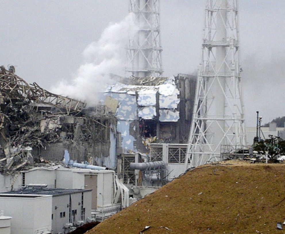 PHOTO: This handout photo shows the smoking No.3 reactor building (L) and the damaged No. 4 reactor building (C) of the quake-hit Fukushima Daiichi Nuclear Power Station on March 15, 2011, in Fukushima Prefecture, Okuma, Japan.