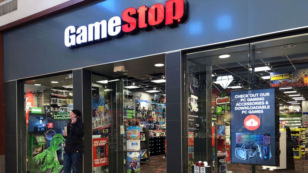 PHOTO: A man talks on a cell phone outside a GameStop store in Gurnee, Ill., Dec. 10, 2019.