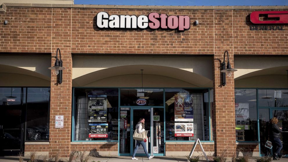 A pedestrian walks past a GameStop Corp. store in Chicago, Nov. 20, 2016.