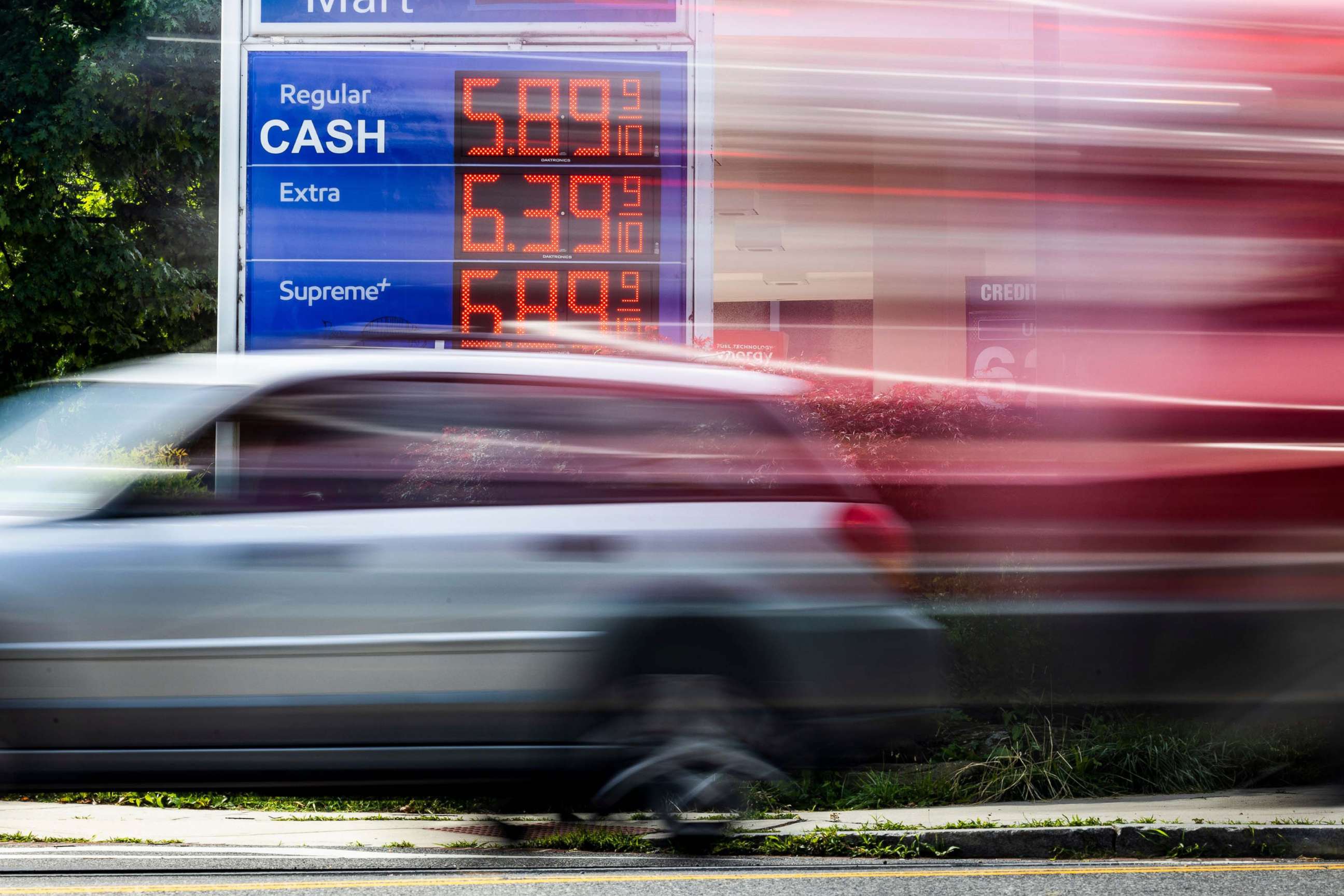 PHOTO: A car drives by an Exxon gas station displaying its prices in Washington DC, June 10, 2022.