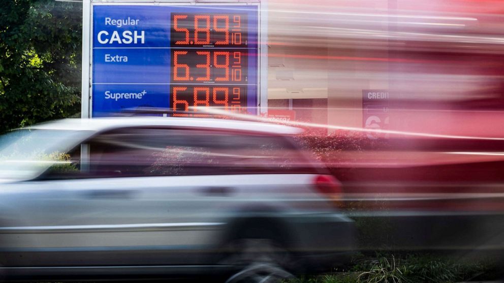 PHOTO: A car drives by an Exxon gas station displaying its prices in Washington DC, June 10, 2022.