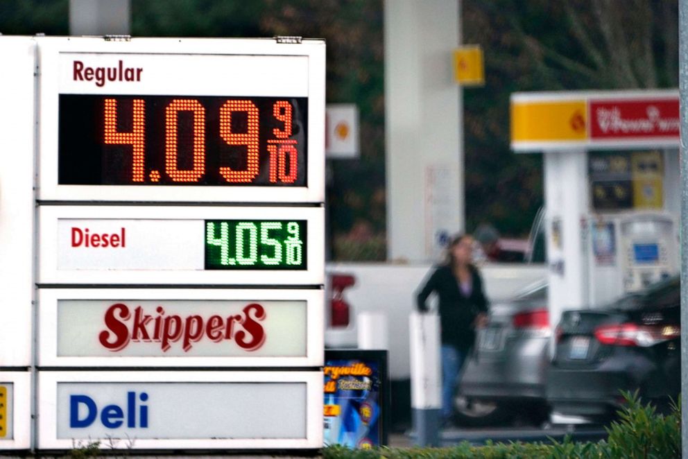PHOTO: In this Dec. 10, 2021, file photo, a driver fills a tank at a gas station in Marysville, Wash. 