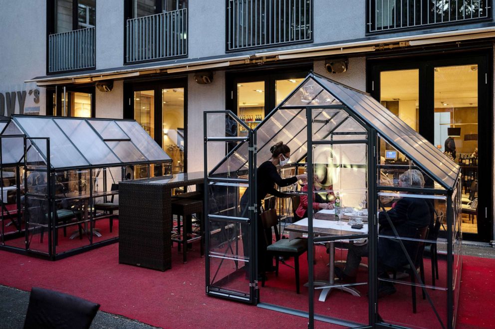PHOTO: In "Novy's Brasserie" guests are served at tables in small greenhouses, in Hagen, Germany, May 14, 2020.