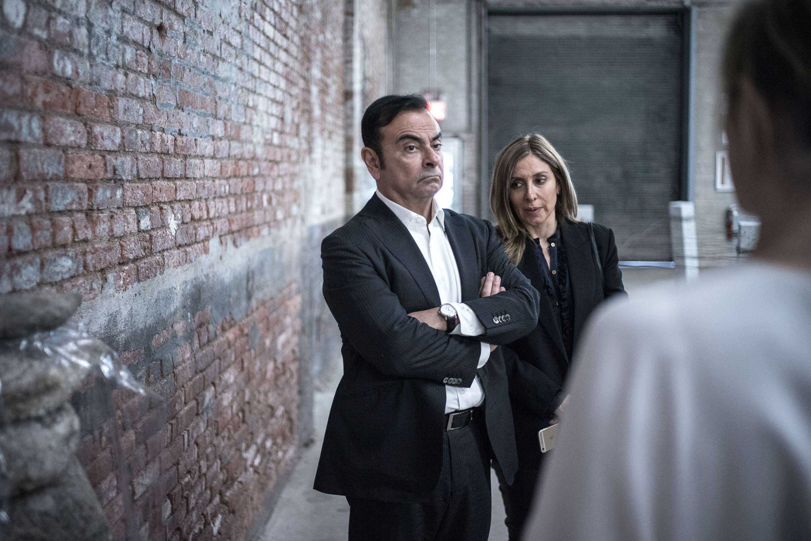 PHOTO: Carlos Ghosn, chairman of Renault SAS, Nissan Motor Co., and Mitsubishi Motors Corp., left, and his wife Carole Nahas view artwork at the DIA Art Foundation in New York, May 6, 2017.