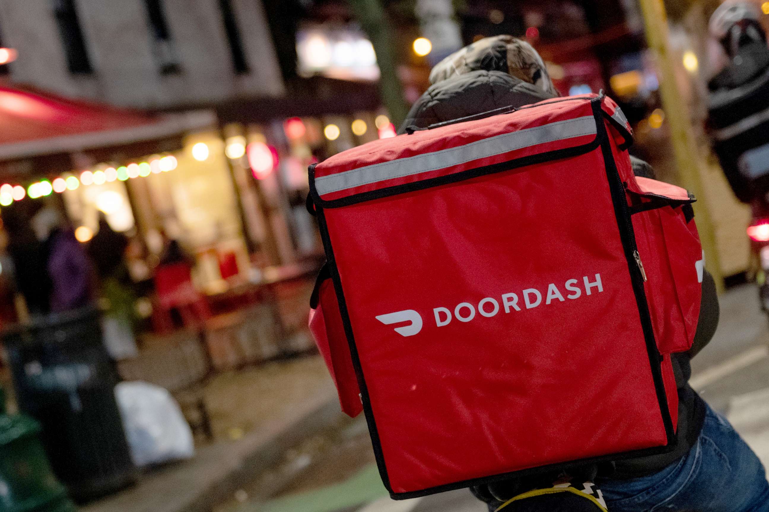 PHOTO: A doordash delivery driver waits near a restaurant on Dec. 30, 2020 in New York City.