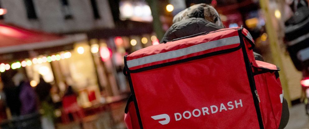 PHOTO: A doordash delivery driver waits near a restaurant on Dec. 30, 2020 in New York City.