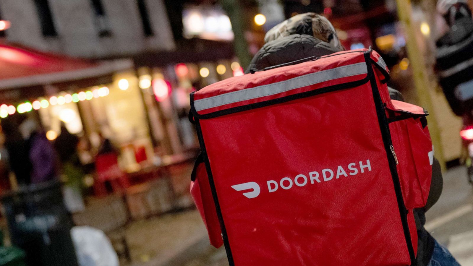 PHOTO: A doordash delivery driver waits near a restaurant on Dec. 30, 2020 in New York City.