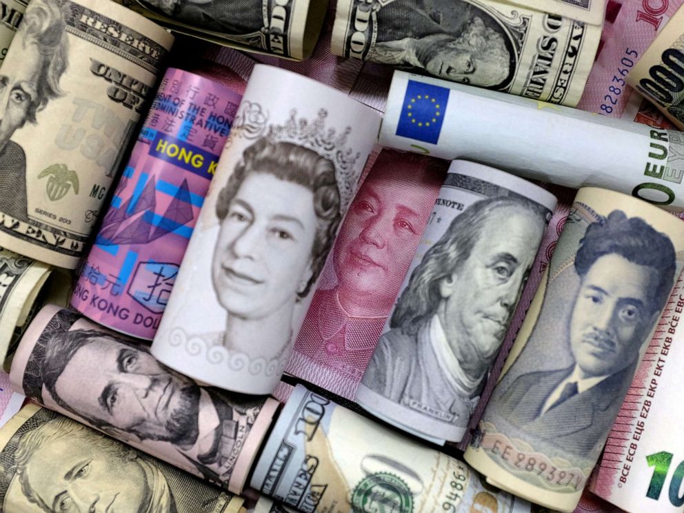 PHOTO: Euro, Hong Kong dollar, U.S. dollar, Japanese yen, pound and Chinese 100 yuan banknotes are seen in this picture illustration.