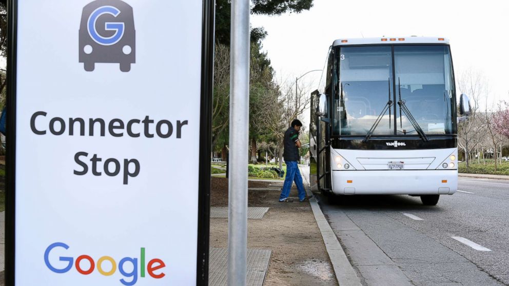A Google Inc. campus bus picks up a passenger near the entrance to the Googleplex headquarters in Mountain View, Calif., Feb. 18, 2016.