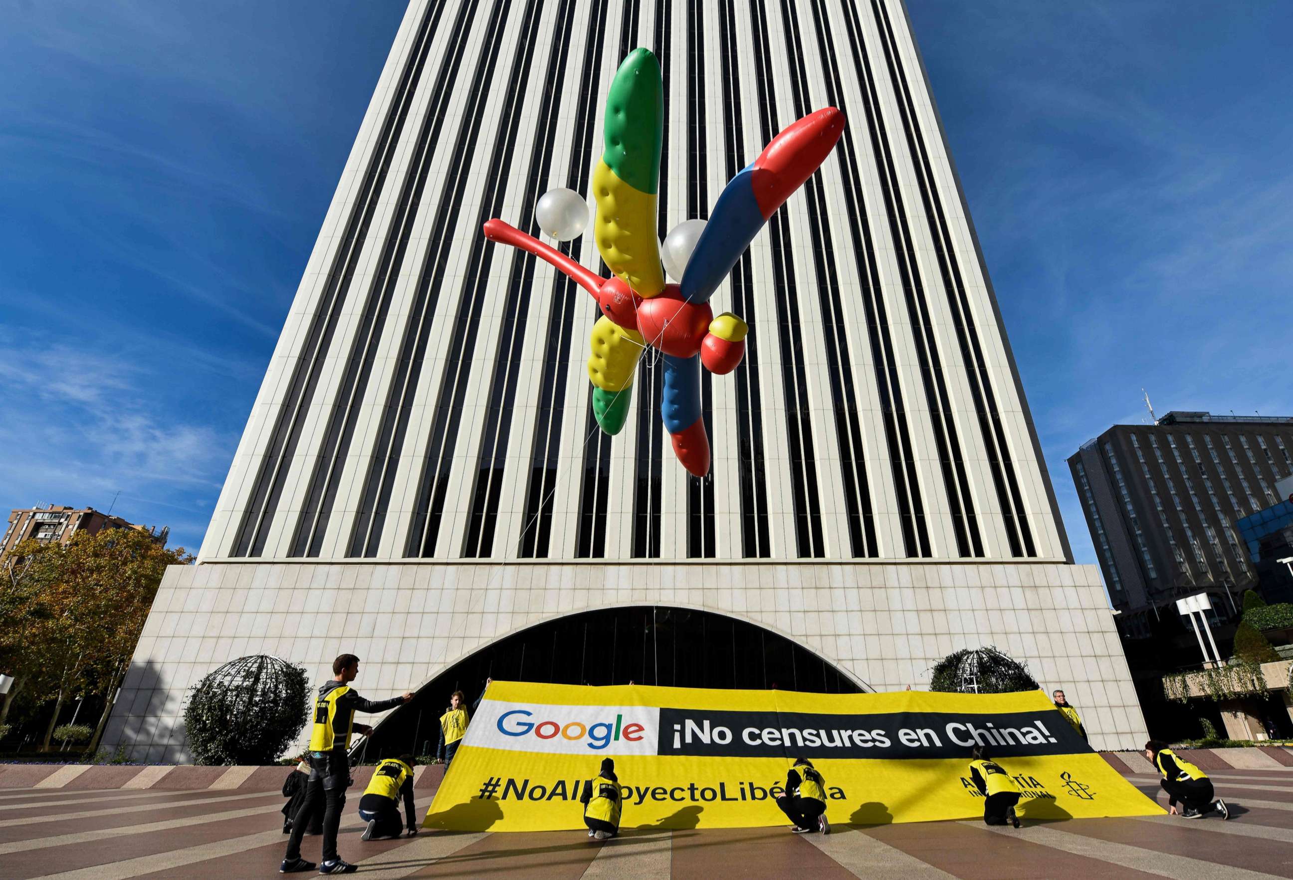 PHOTO: Amnesty International activists hold a giant dragonfly-shaped balloon with a banner reading "Google, do not censor in China, no to the Dragonfly project" during a protest outside the Google headquarters in Madrid, Nov. 27, 2018.