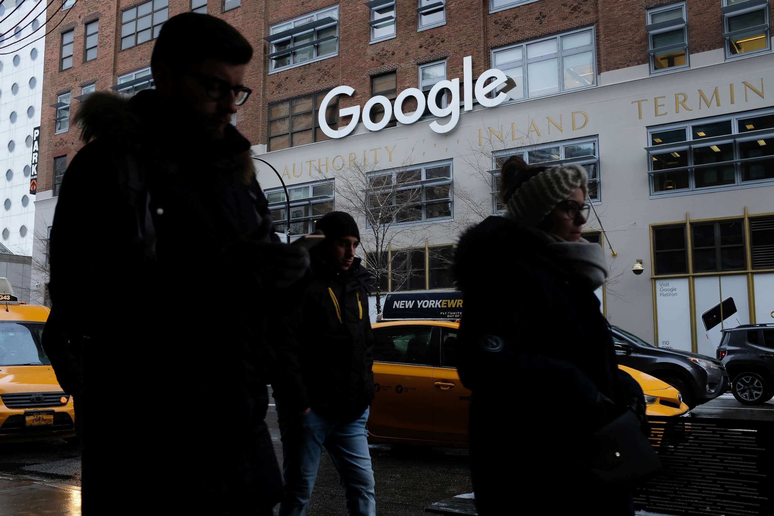 PHOTO: People walk past a Google office building on 9th Avenue in Chelsea district in New York, Dec. 30, 2017.
