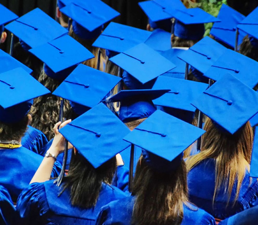 PHOTO: A celebration of graduation with a sea of blue graduation caps and robes is captured in this undated stock photo.