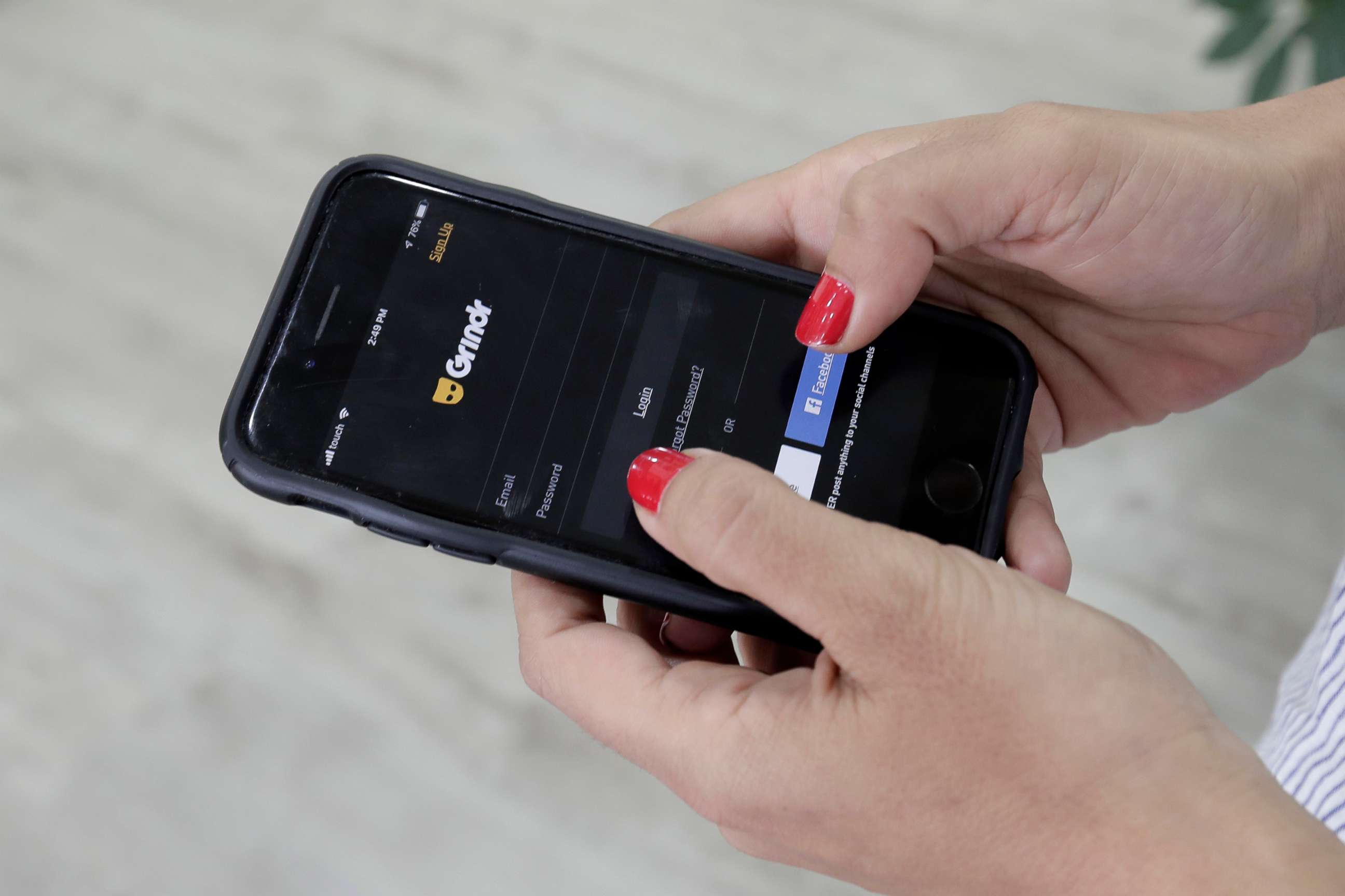 PHOTO: A woman checks the Grindr app on her mobile phone in Beirut, Lebanon, May 29, 2019.