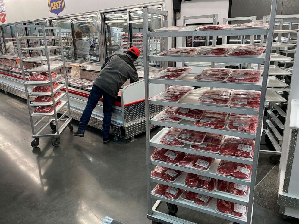 PHOTO: An employee restocks meat at a grocery store, Jan. 17, 2023, in North Miami, Fla.