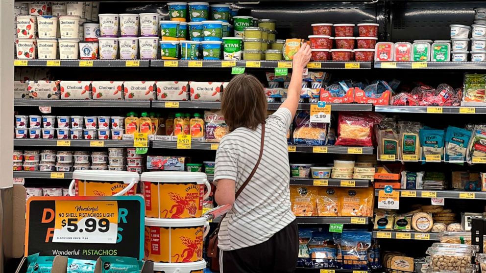 PHOTO: A customer looks at refrigerated items at a Grocery Outlet store in Pleasanton, Calif., Sept. 15, 2022.