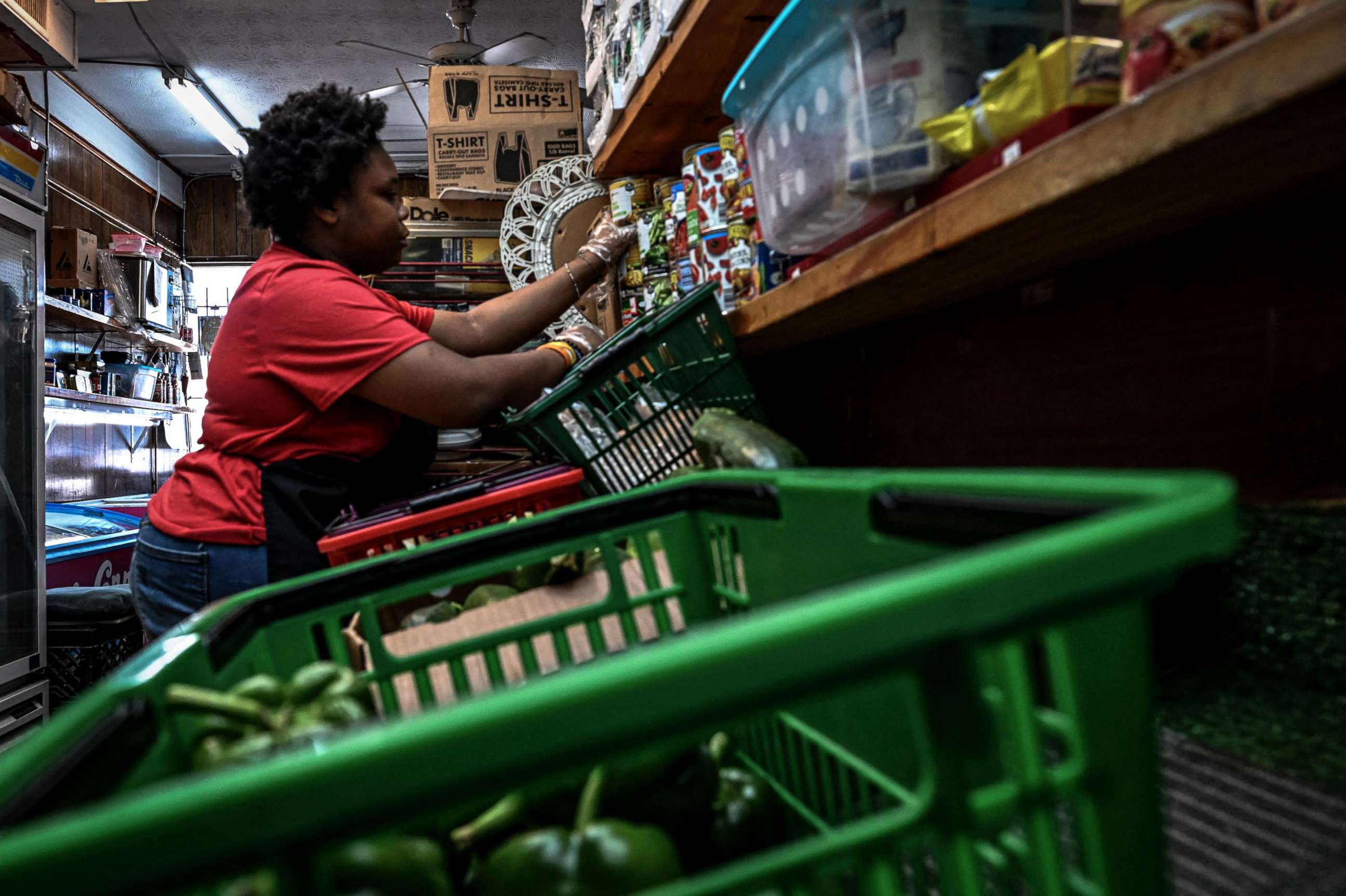PHOTO: An employee stacks cans of food at a grocery store in the Moncrief Park neighborhood of Jacksonville, Florida, on October 14, 2022.