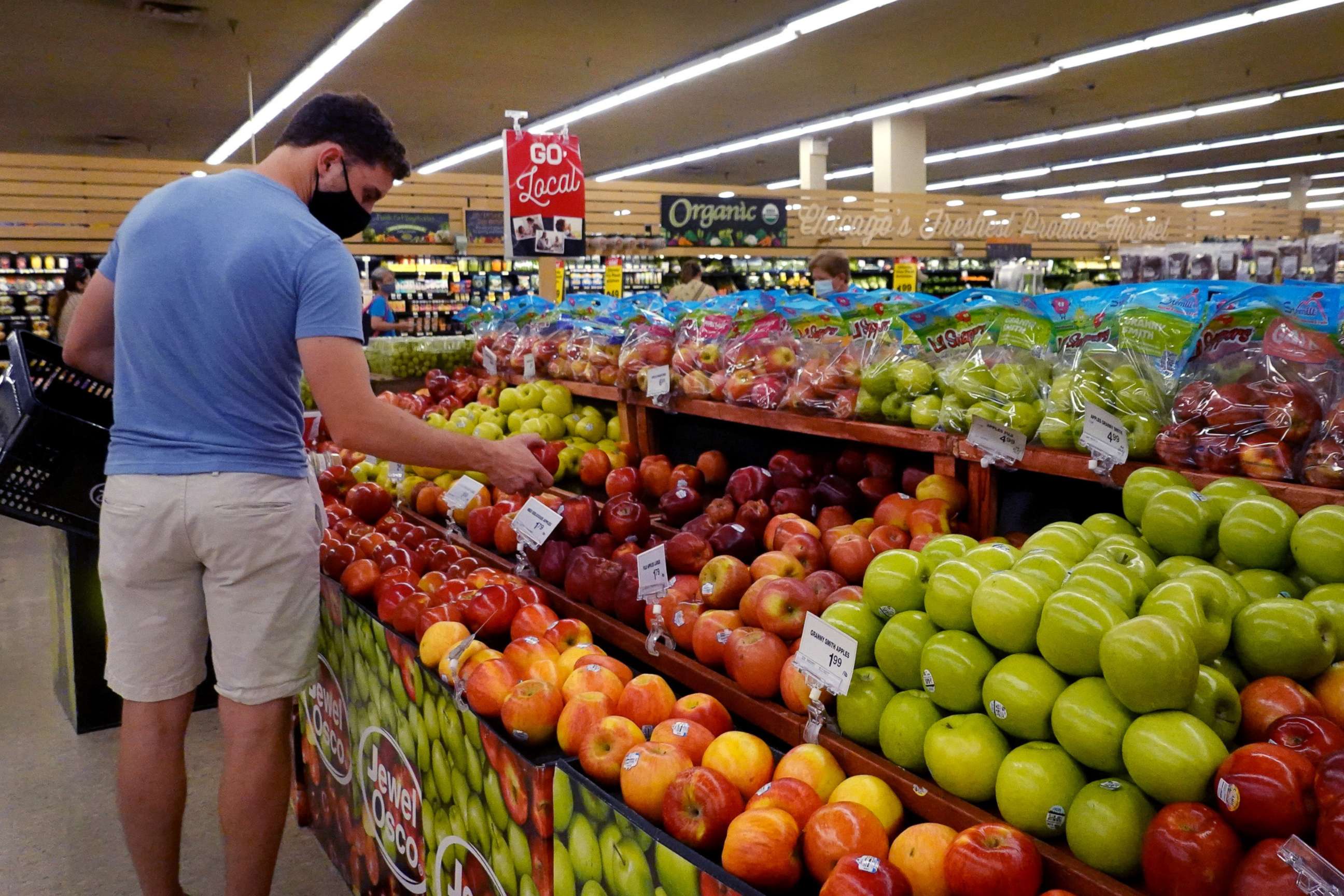PHOTO: Customers shop for produce at a supermarket on June 10, 2021 in Chicago.