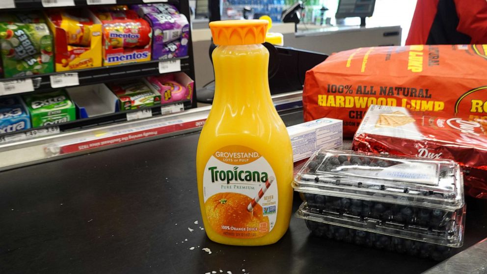 PHOTO: A bottle of orange juice sits at the checkout counter of a grocery store on January 19, 2023 in Miami, Florida.