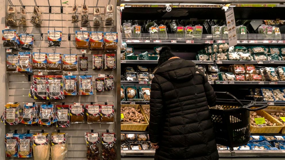 PHOTO: A shopper looks for produce in a Whole Foods Market supermarket in New York on Jan. 9, 2022.