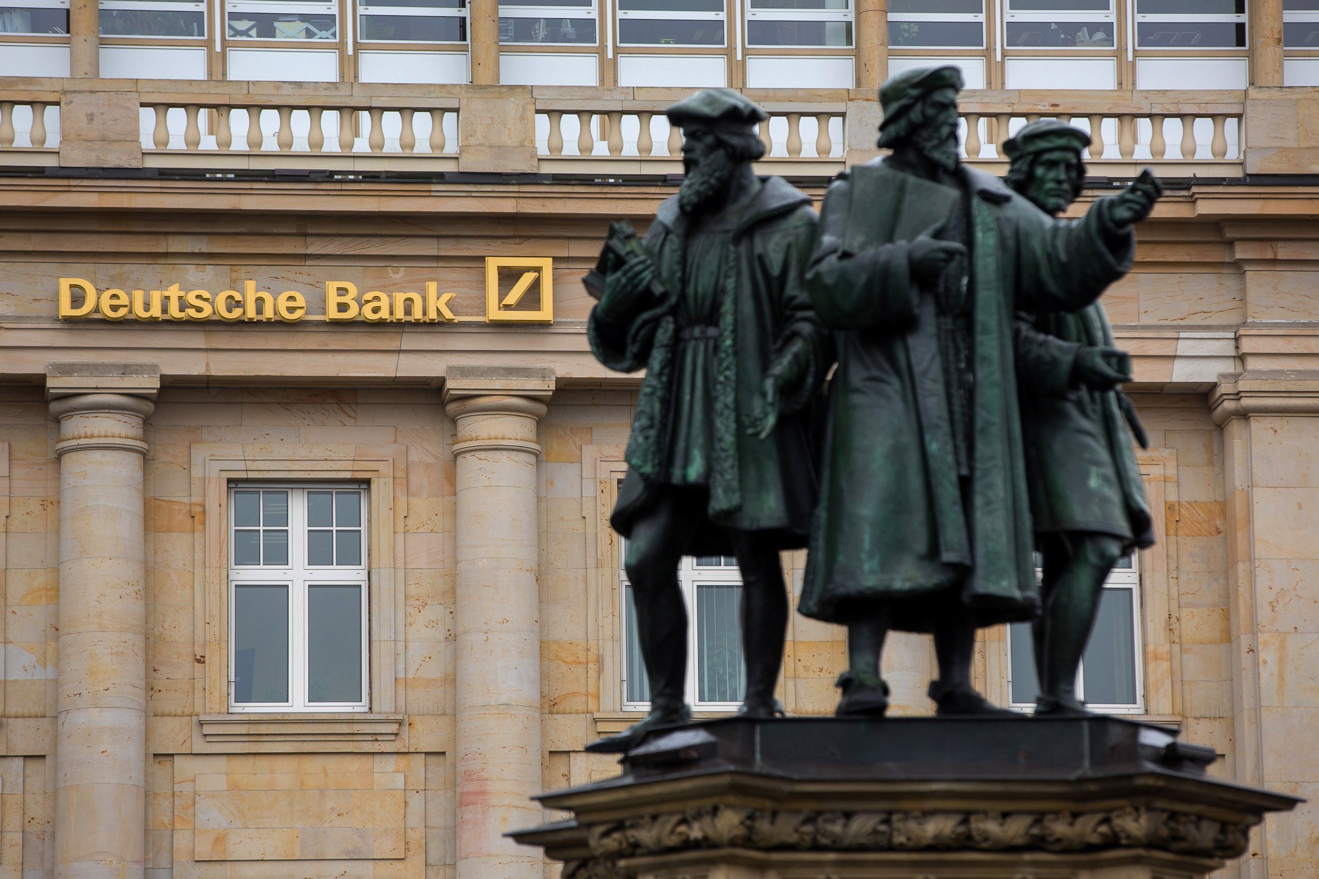 PHOTO: Statues stand outside a Deutsche Bank AG bank branch in Frankfurt, Germany, on Oct. 20, 2016.