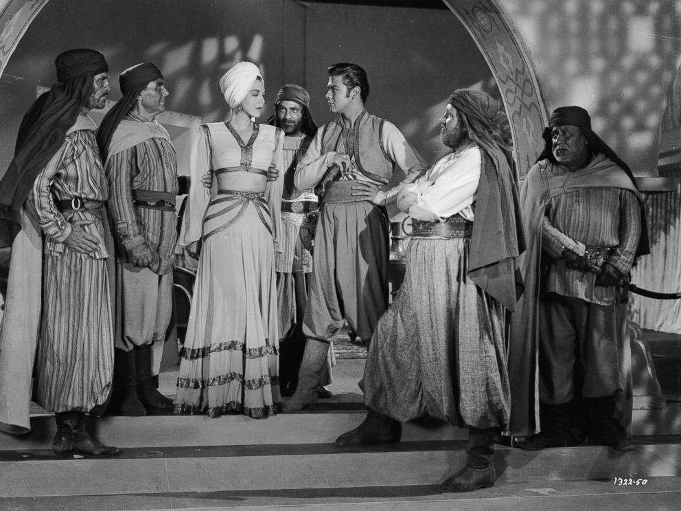 PHOTO: Turhan Bey stars with Maria Montez in "Ali Baba and the Forty Thieves" directed by Arthur Lubin in 1944.