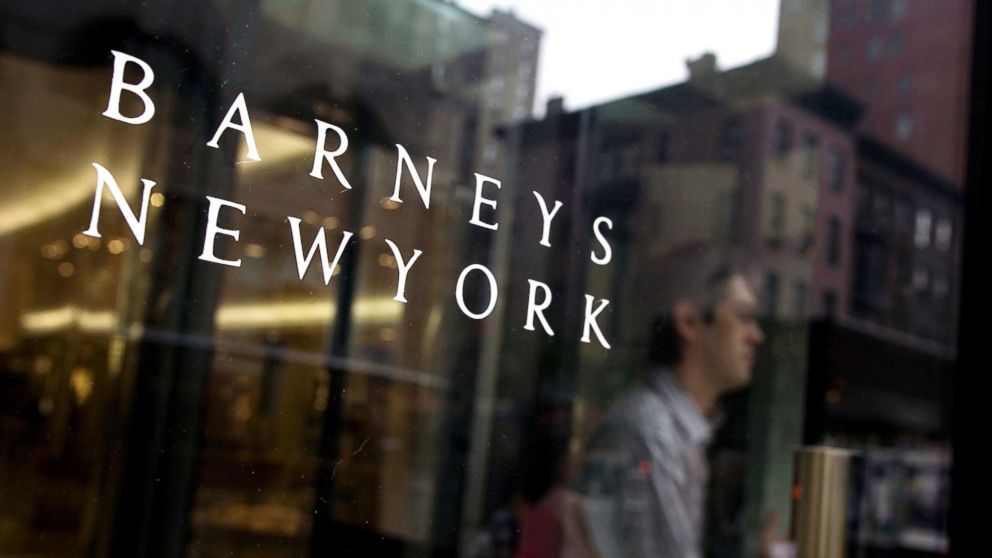 A shopper walks through the entrance of a Barneys New York store in New York, in this July 5, 2007 photo.