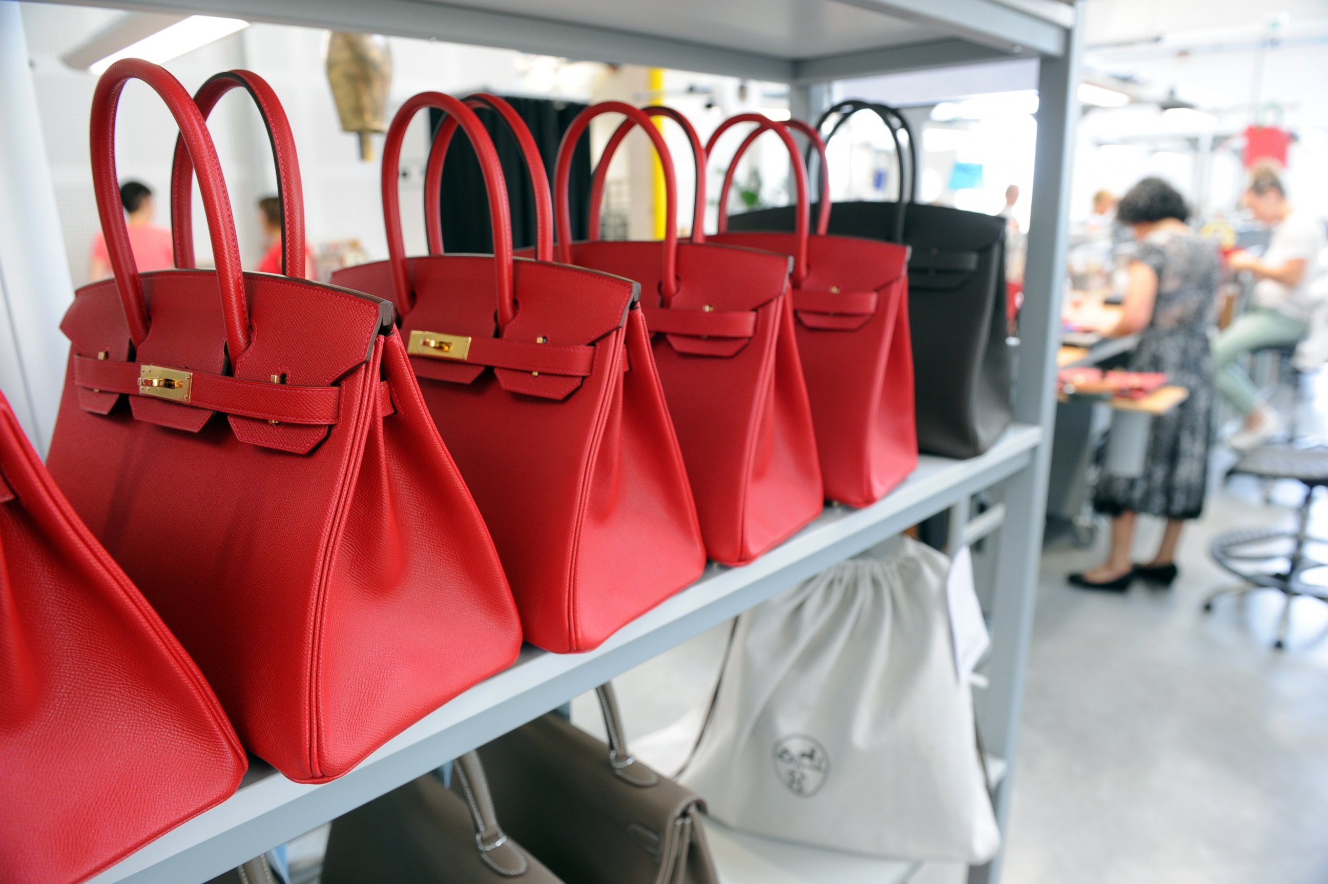 PHOTO: A photo taken on June 11, 2015 shows Hermes Birkin bags at the Maroquinerie de la Tardoire, a Hermes workshop specialized in products made with calfskin, in Montbron, southwestern France. 