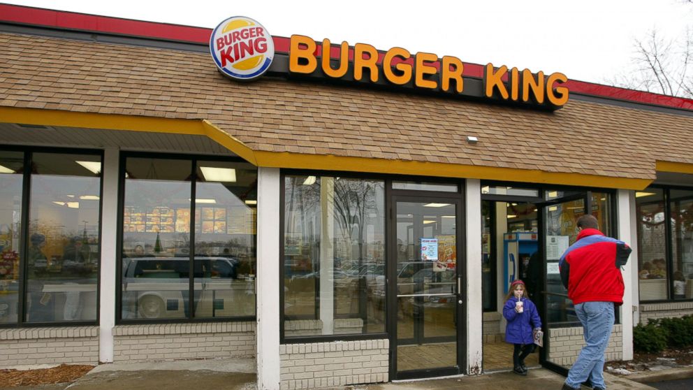 PHOTO: Customers leave a Burger King restaurant December 13, 2002 in Park Ridge, Illinois. 