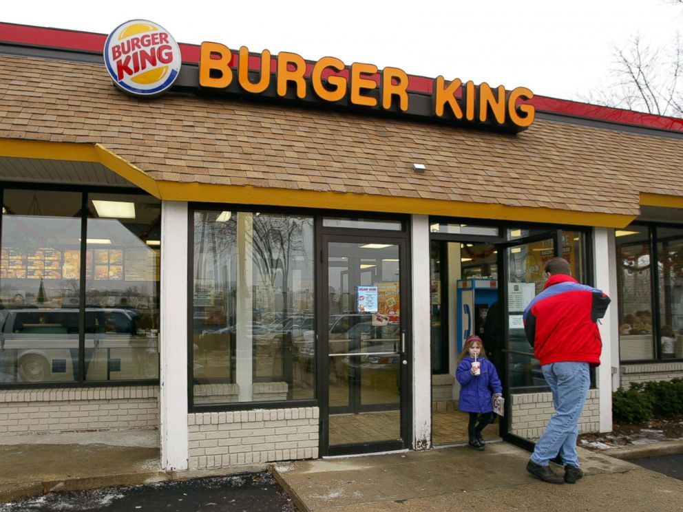 PHOTO: Customers leave a Burger King restaurant December 13, 2002 in Park Ridge, Illinois.