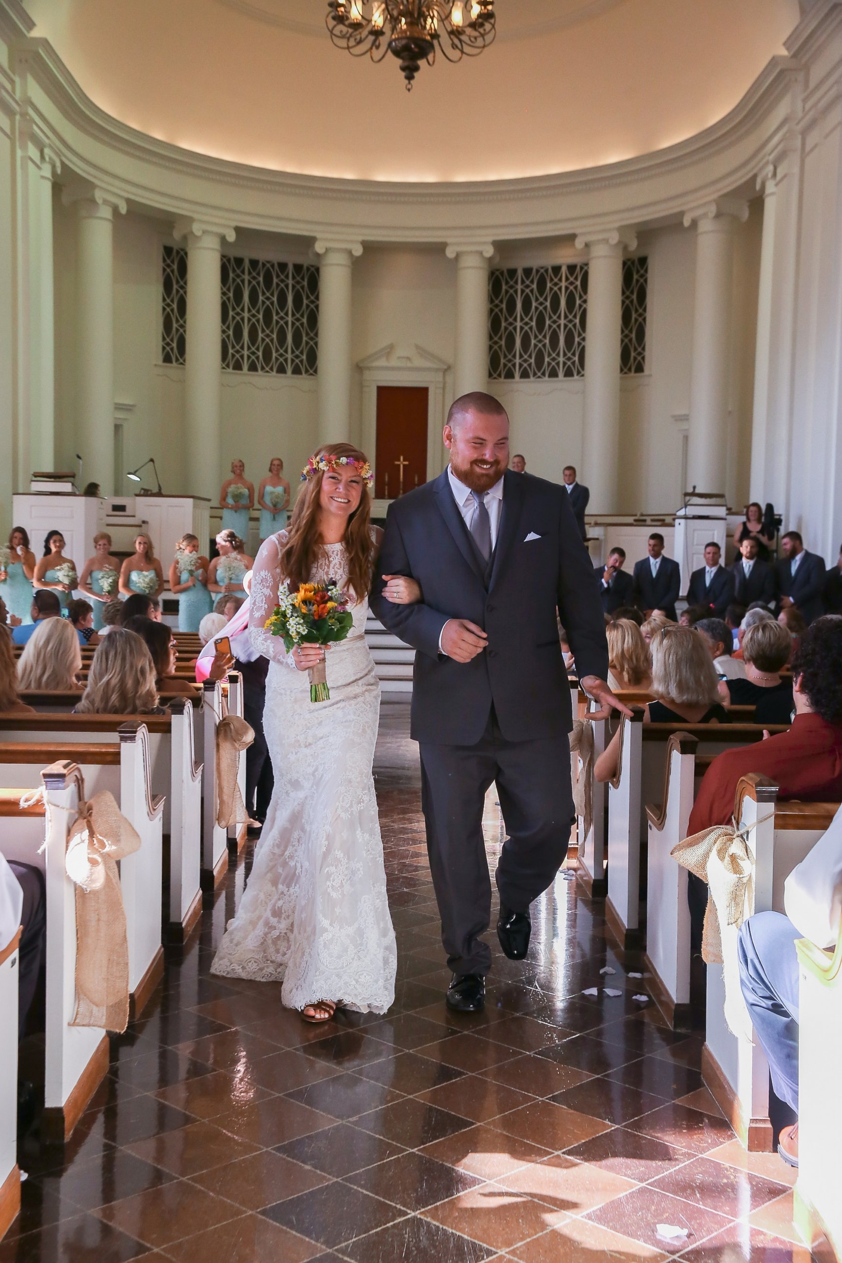 PHOTO: Ashley King and Joel Burger walk down the aisle after exchanging wedding vows, July 17, 2015, in Jacksonville, Ill. 